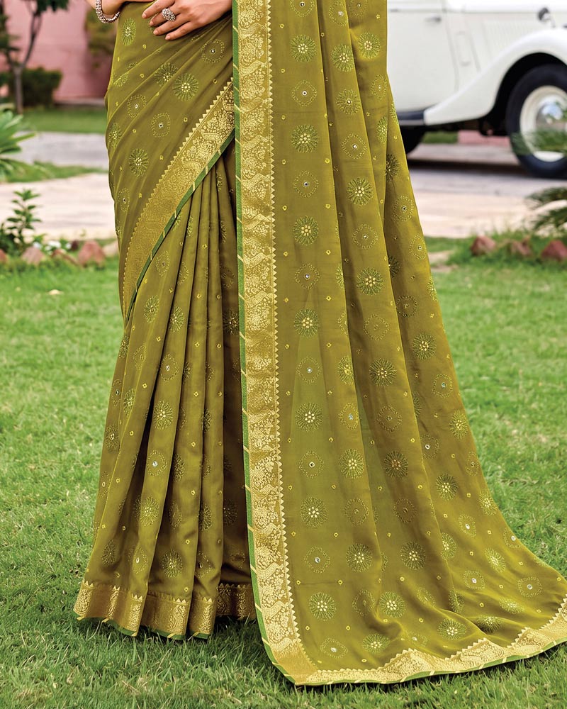 Vishal Prints Dusty Mehandi Green Traditional Print Georgette Saree With Mirror Work And Zari Border