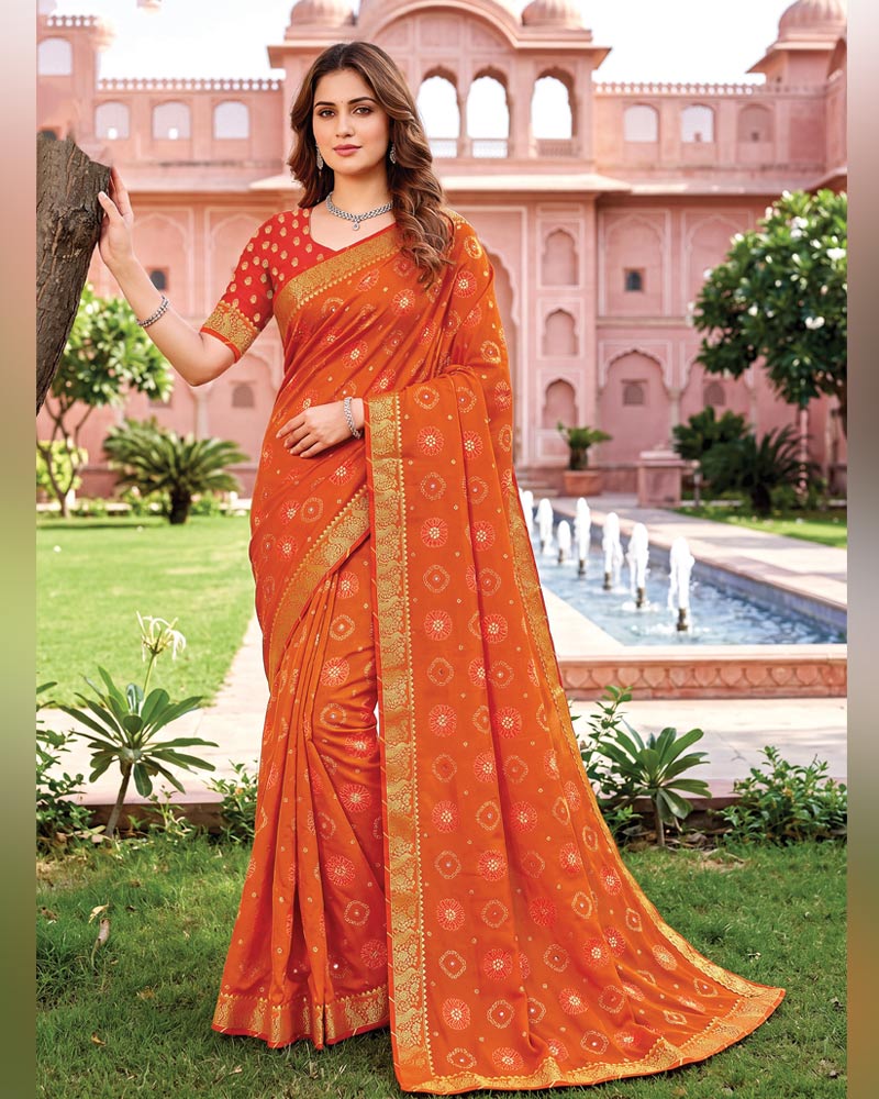 Vishal Prints Flame Orange Traditional Print Georgette Saree With Mirror Work And Zari Border