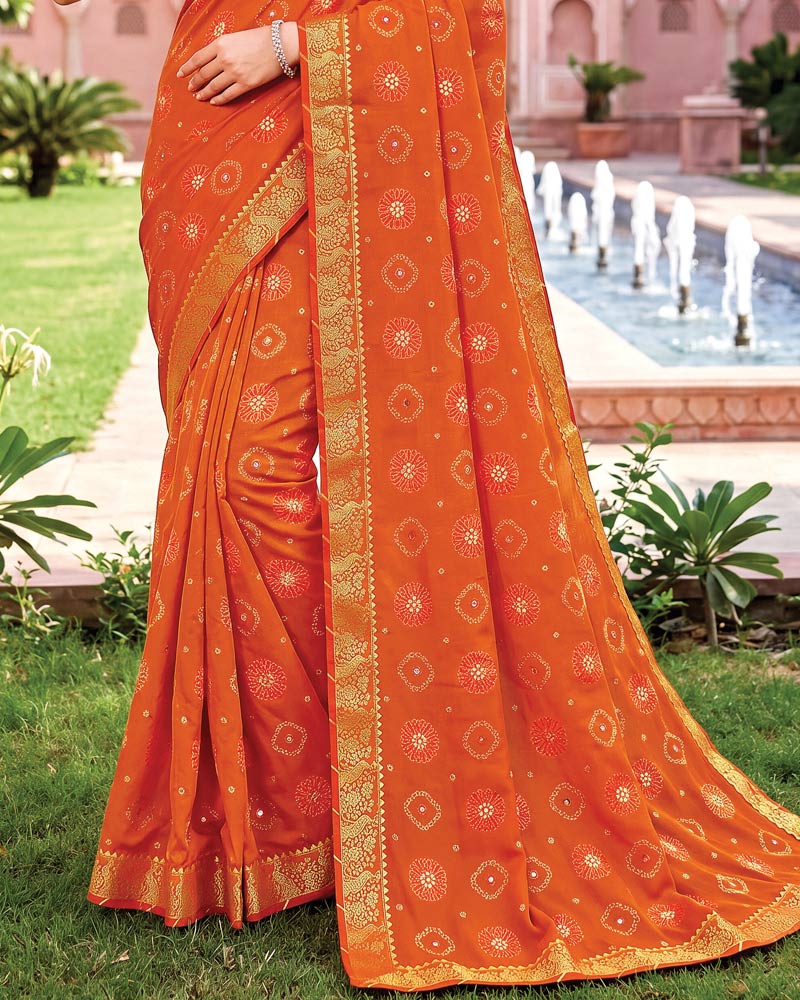 Vishal Prints Flame Orange Traditional Print Georgette Saree With Mirror Work And Zari Border