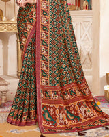 Vishal Prints Dark Green And Coral Red Fancy Satin Traditional Patola Print Saree With Diamond Work-Core Piping And Tassel