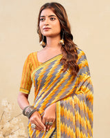 Vishal Prints Orangey Yellow Printed Brasso Saree With Fancy Border