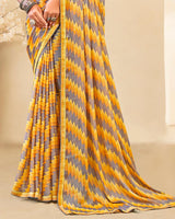 Vishal Prints Orangey Yellow Printed Brasso Saree With Fancy Border