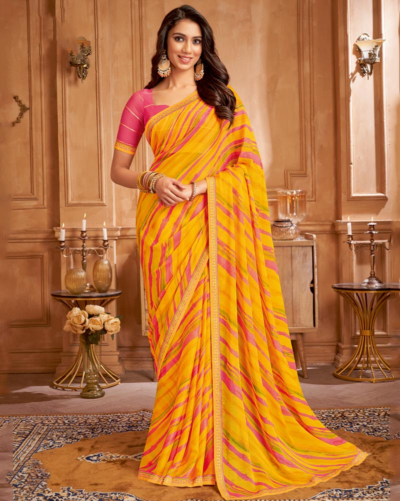 Vishal Prints Orangey Yellow Printed Brasso Saree With Fancy Border