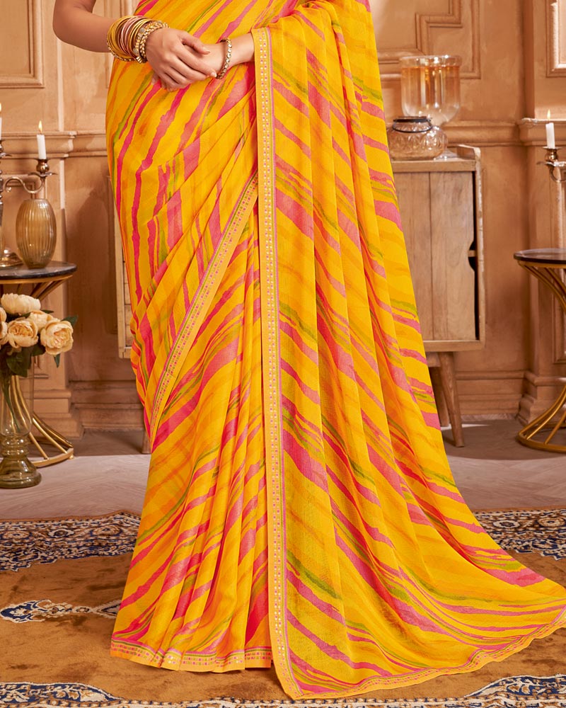 Vishal Prints Orangey Yellow Printed Brasso Saree With Fancy Border