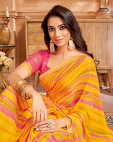 Vishal Prints Orangey Yellow Printed Brasso Saree With Fancy Border