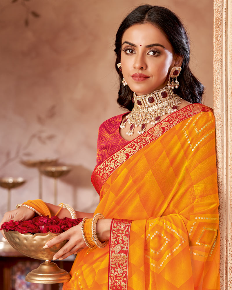 Vishal Prints Dark Orange Printed Georgette Saree With Foil Print And Zari Border