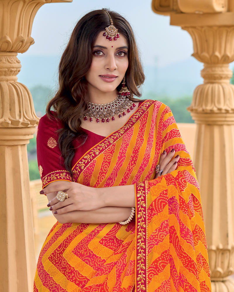 Vishal Prints Pumpkin Orange Printed Chiffon-Brasso Saree With Fancy Border