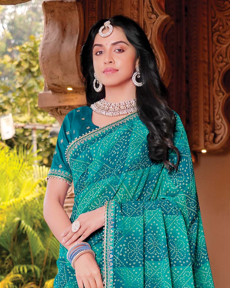 Vishal Prints Deep Teal Blue Designer Georgette Traditional Print Saree With Foil Print And Fancy Embroidery Border