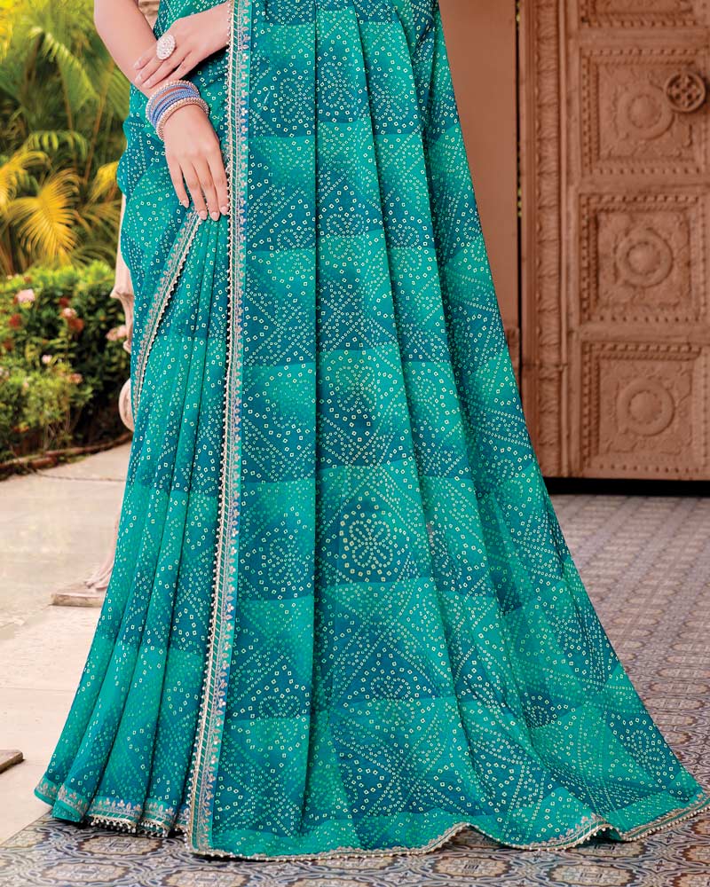 Vishal Prints Deep Teal Blue Designer Georgette Traditional Print Saree With Foil Print And Fancy Embroidery Border