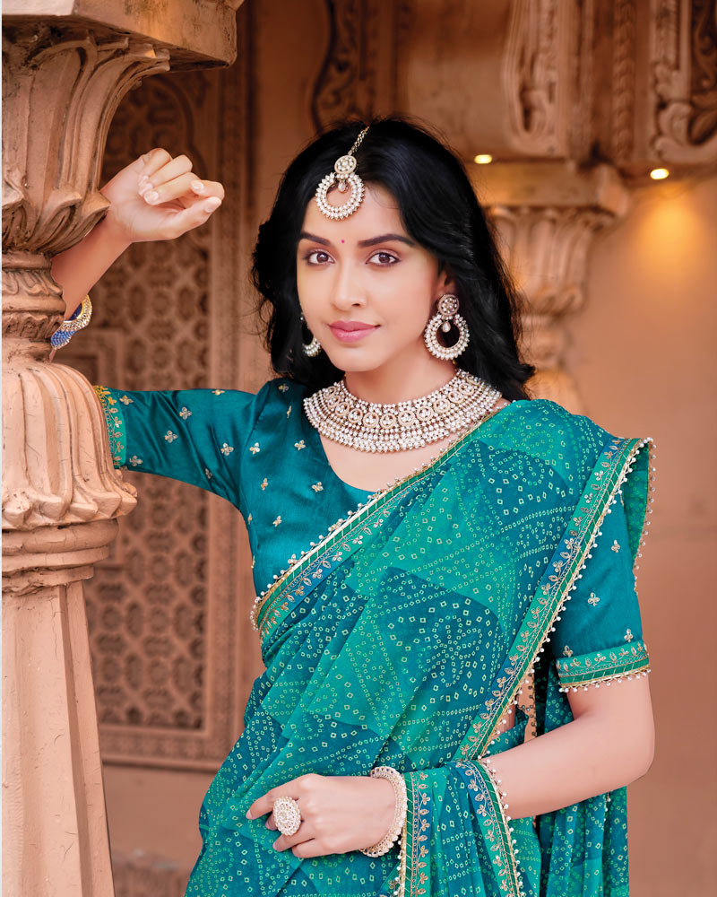 Vishal Prints Deep Teal Blue Designer Georgette Traditional Print Saree With Foil Print And Fancy Embroidery Border