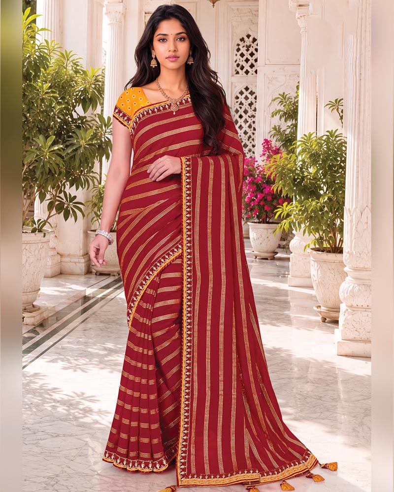 Vishal Prints Maroon Georgette Saree With Foil Print And Fancy Embroidery Border With Tassel