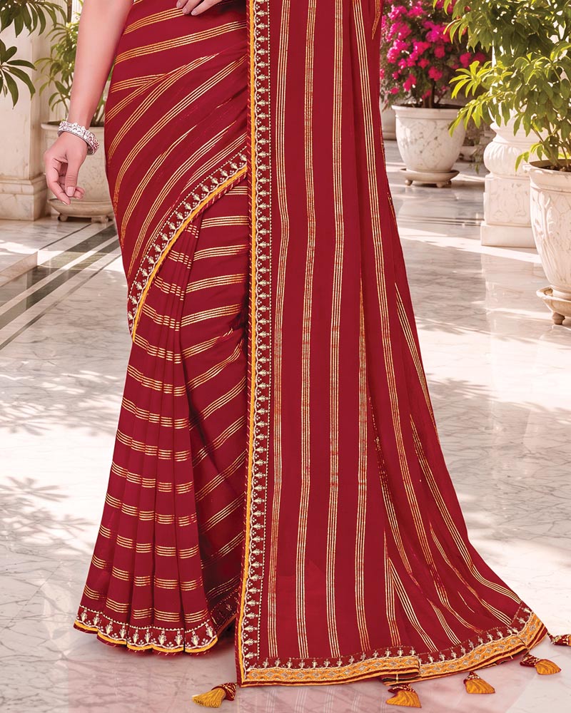 Vishal Prints Maroon Georgette Saree With Foil Print And Fancy Embroidery Border With Tassel