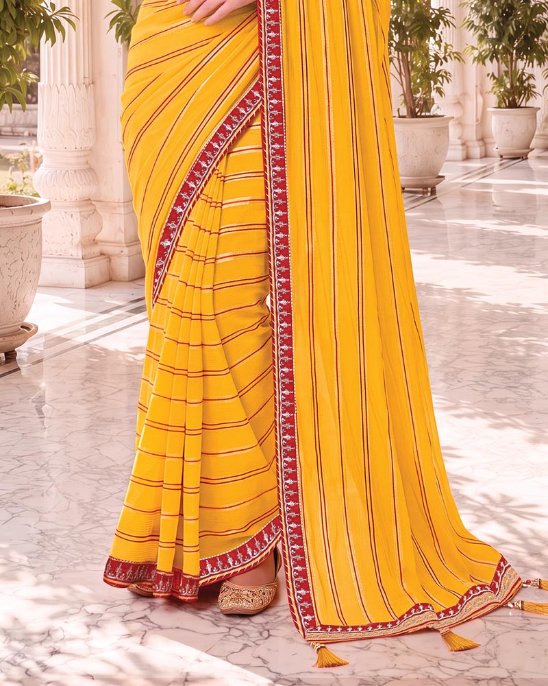 Vishal Prints Bright Yellow Georgette Saree With Foil Print And Fancy Embroidery Border With Tassel