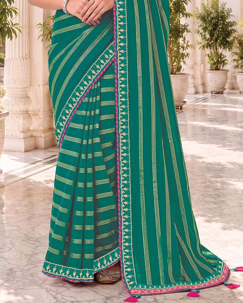 Vishal Prints Teal Green Georgette Saree With Foil Print And Fancy Embroidery Border With Tassel