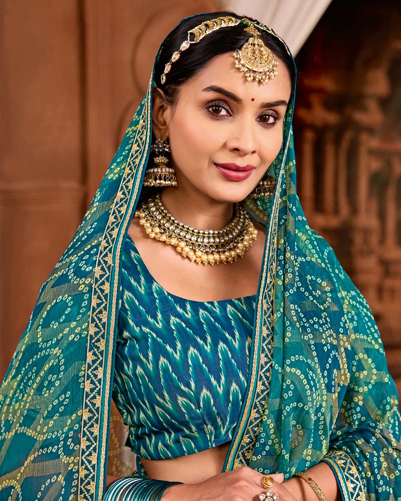 Vishal Prints Mor Blue Traditional Print Brasso Saree With Fancy Embroidery Border