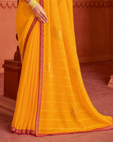 Vishal Prints Yellowish Orange Patterned Chiffon Saree With Foil Print And Zari Border