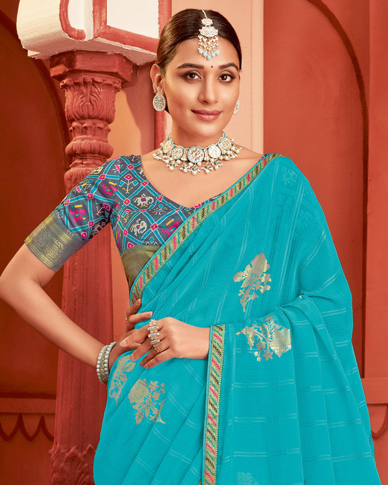 Vishal Prints Dark Turquoise Blue Patterned Chiffon Saree With Foil Print And Zari Border