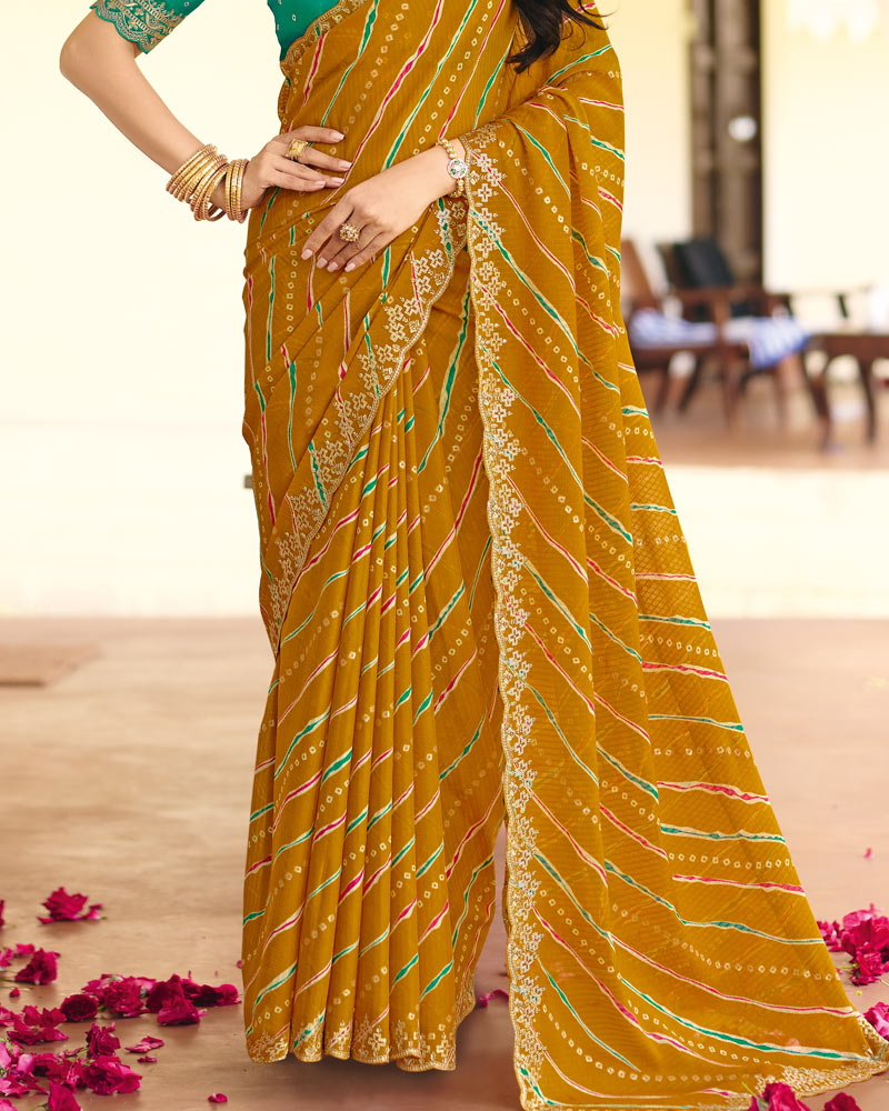Vishal Prints Deep Mustard Traditional Printed Fancy Chiffon Saree With Foil Print And Cut Work Embroidery Border