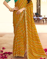Vishal Prints Deep Mustard Traditional Printed Fancy Chiffon Saree With Foil Print And Cut Work Embroidery Border