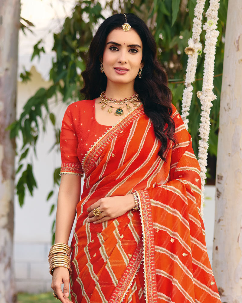 Vishal Prints Bright Orange Traditional Printed Fancy Chiffon Saree With Foil Print And Embroidery Border