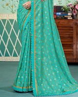 Vishal Prints Persian Green Printed Brasso Saree With Foil Print And Fancy Border