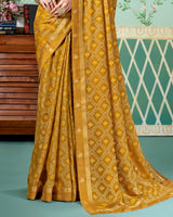 Vishal Prints Mustard Brown Printed Brasso Saree With Foil Print And Fancy Border