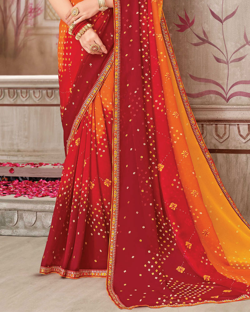 Vishal Prints Deep Saffron Printed Chiffon Bandhani Print Saree With Foil Print And Fancy Border