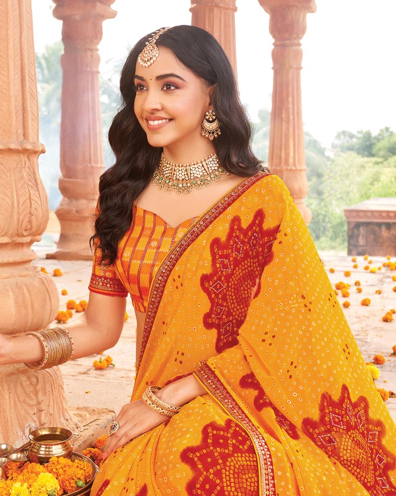 Vishal Prints Orangey Yellow Printed Georgette Traditional Print Saree With Diamond Work And Fancy Border