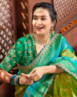 Vishal Prints Mehandi And Dark Green Silk Weaving Saree With Zari Border And Tassel