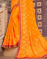 Vishal Prints Orange Brasso Saree With Foil Print And Border