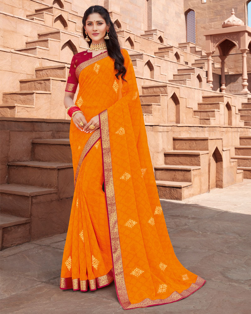 Vishal Prints Bright Orange Georgette Saree With Foil Work And Zari Border