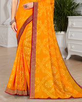 Vishal Prints Yellowish Orange Brasso Saree With Foil Print And Zari Border